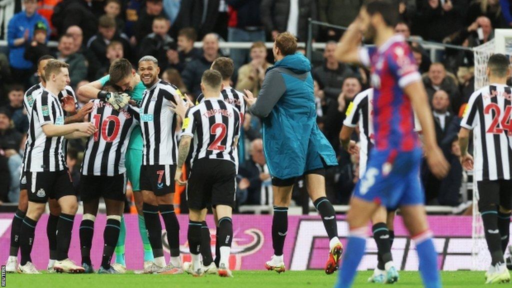 Nick Pope is congratulated by his Newcastle team-mates