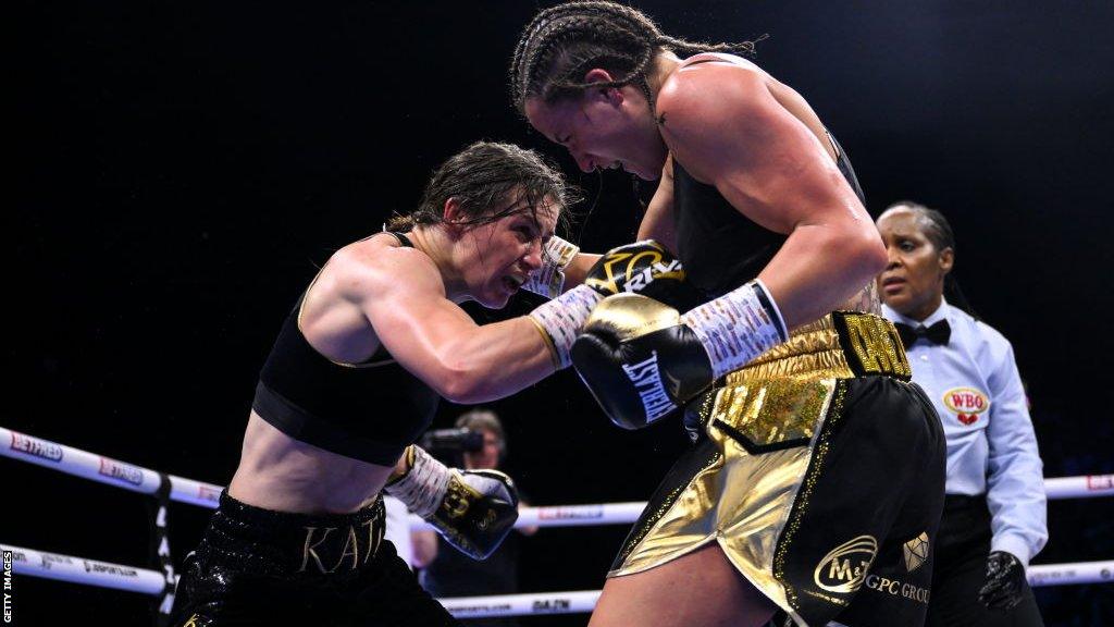 Katie Taylor is punches by Chantelle Cameron