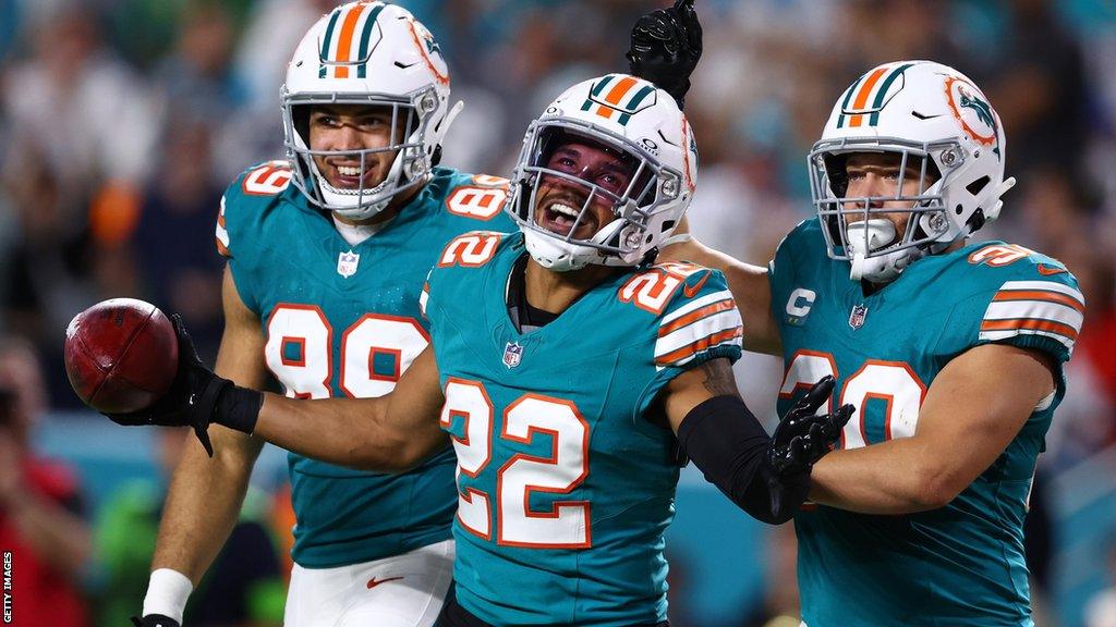 Miami Dolphins players celebrate