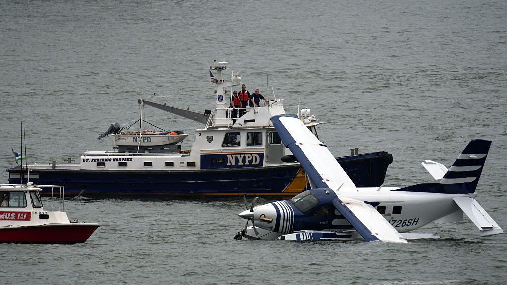 Emergency services on a boat respond to a crashed seaplane in the East River on 5 July 2026 in New York City.