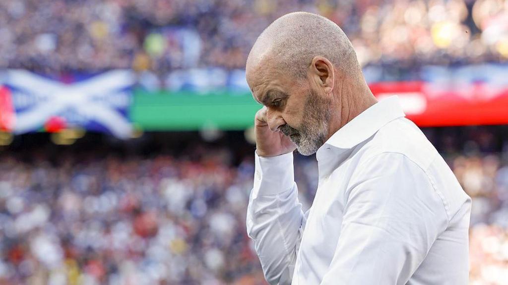 Steve Clarke walks away from the touchline with his head bowed looking disappointed