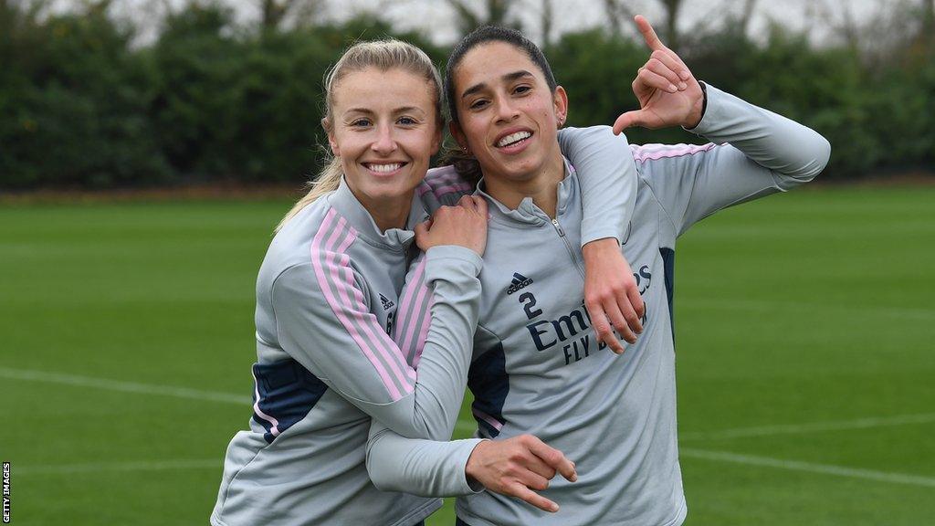 Leah Williamson (left) and Rafaelle Souza hugging at Arsenal training