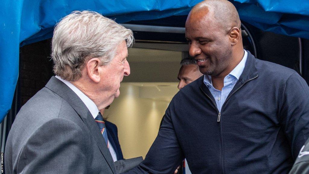 Roy Hodgson greets Patrick Vieira on the touchline