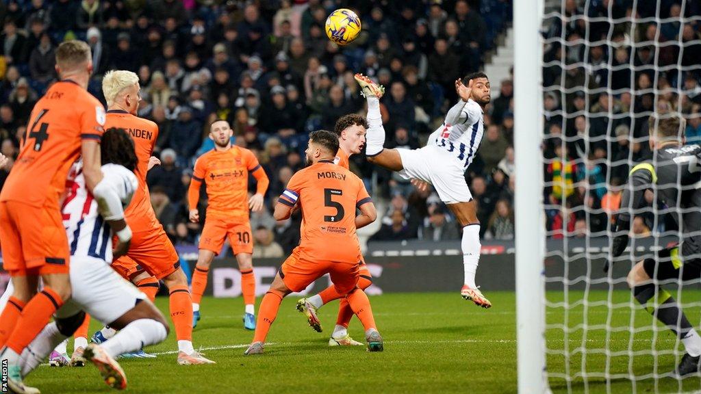 West Bromwich Albion's Darnell Furlong (right) flicks the ball into the goal for the opening goal of the game during the Sky Bet Championship match at The Hawthorns, West Bromwich.