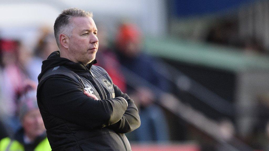 Peterborough manager Darren Ferguson watches from the touchline during a game