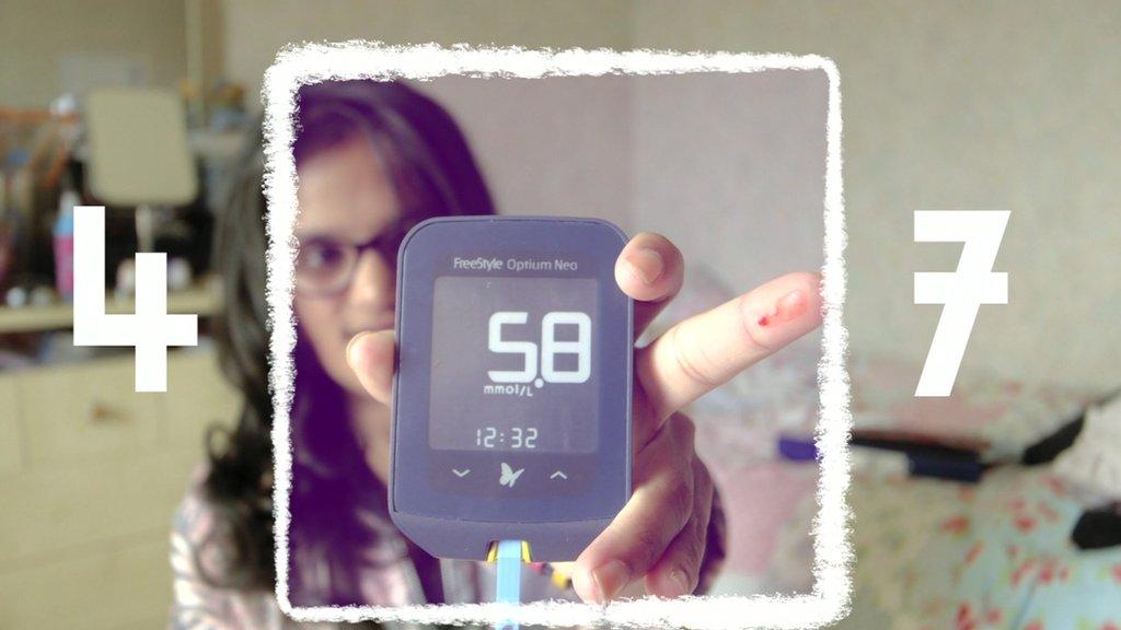 Sarah showing her blood sugar reading