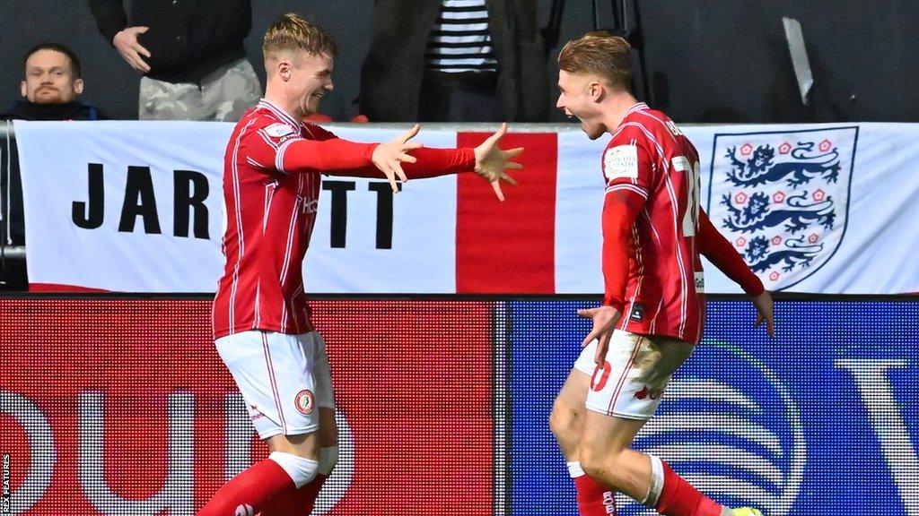 Tommy Conway (left) puts his arms out to hug Sam Bell (right) following a goal