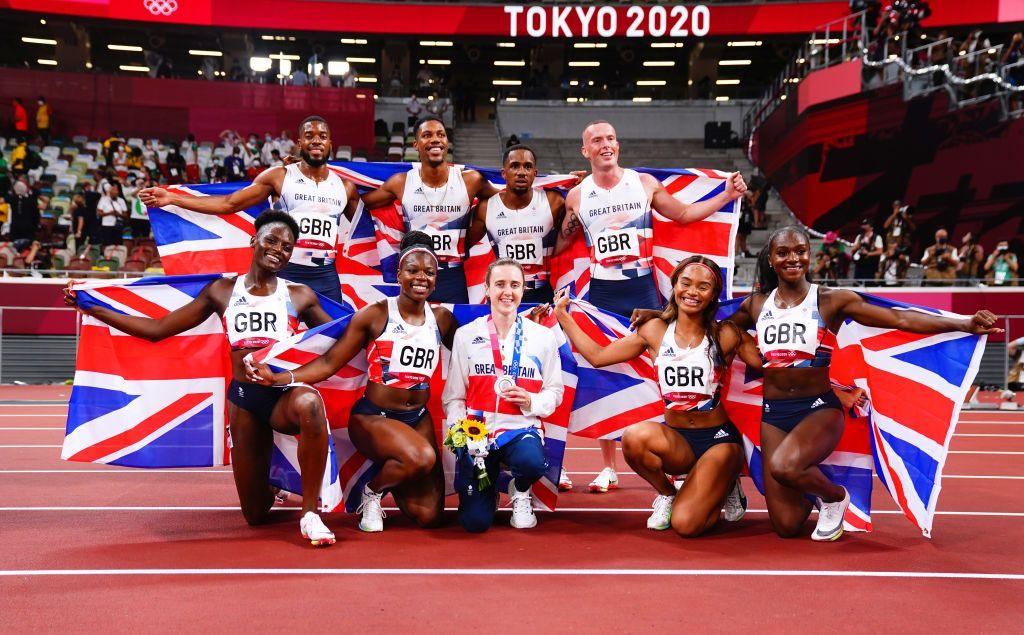 Chijindu Ujah, Zharnel Hughes Richard Kilty and Nethaneel Mitchell-Blake celebrate winning silver as they pose with Asha Philip, Imani Lansiquot, Dina Asher-Smith and Daryll Neita after they won bronze in the women's 4 x 100m relay at Tokyo 2020