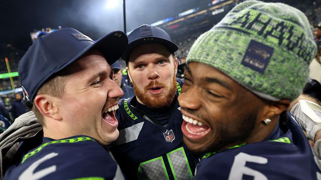 Sam Darnold celebrates Seattle's win with team-mates