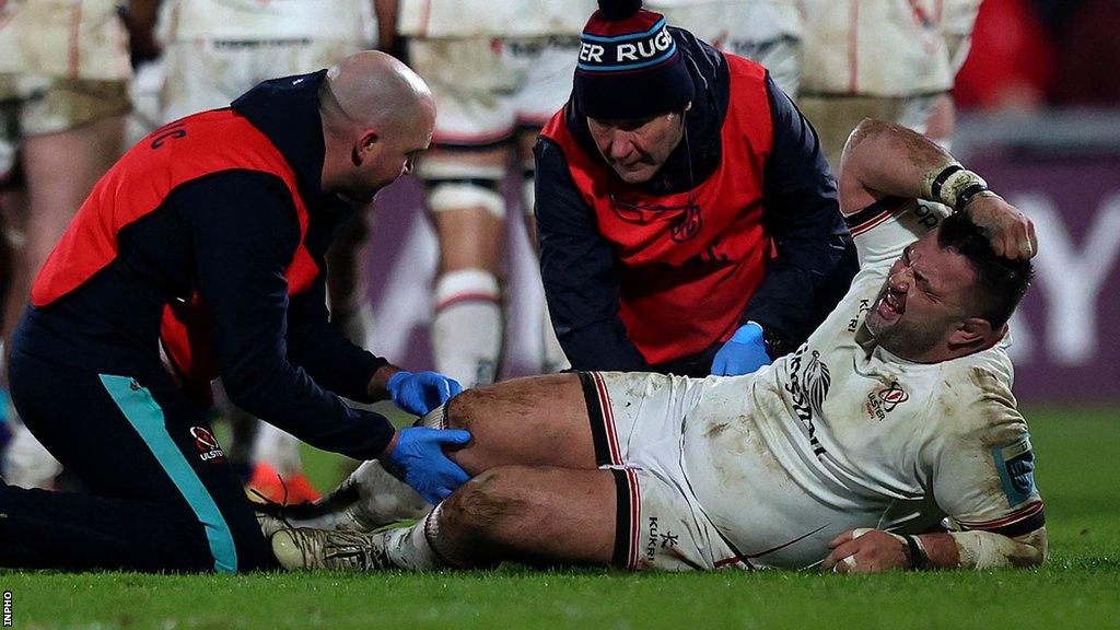 Marty Moore receives treatment for his knee injury in the New Year's Day derby encounter