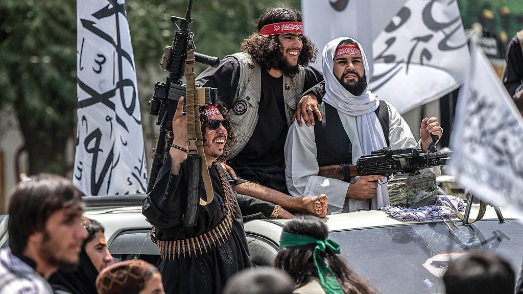 A convoy of Taliban security personnel moves along a street as they celebrate the fourth anniversary of their takeover of Afghanistan in Kabul on August 15, 2025.