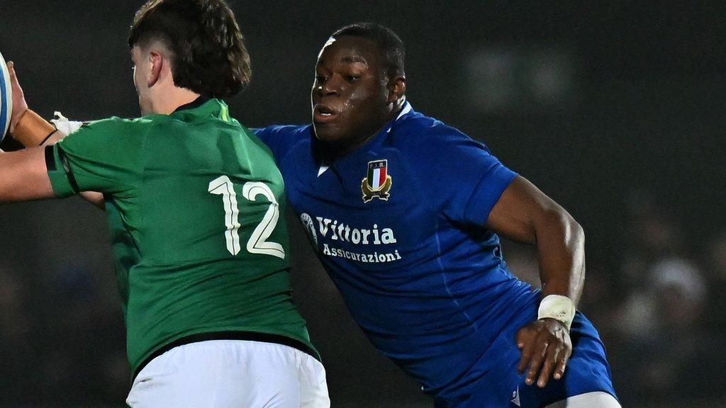 Italy's David Odiase tackles and Ireland player in the U20 Six Nations