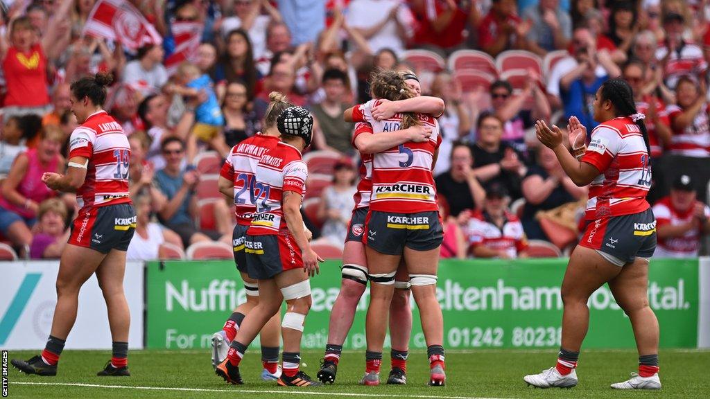 Gloucester-Hartpury players celebrate beating Bristol Bears in the semi-final