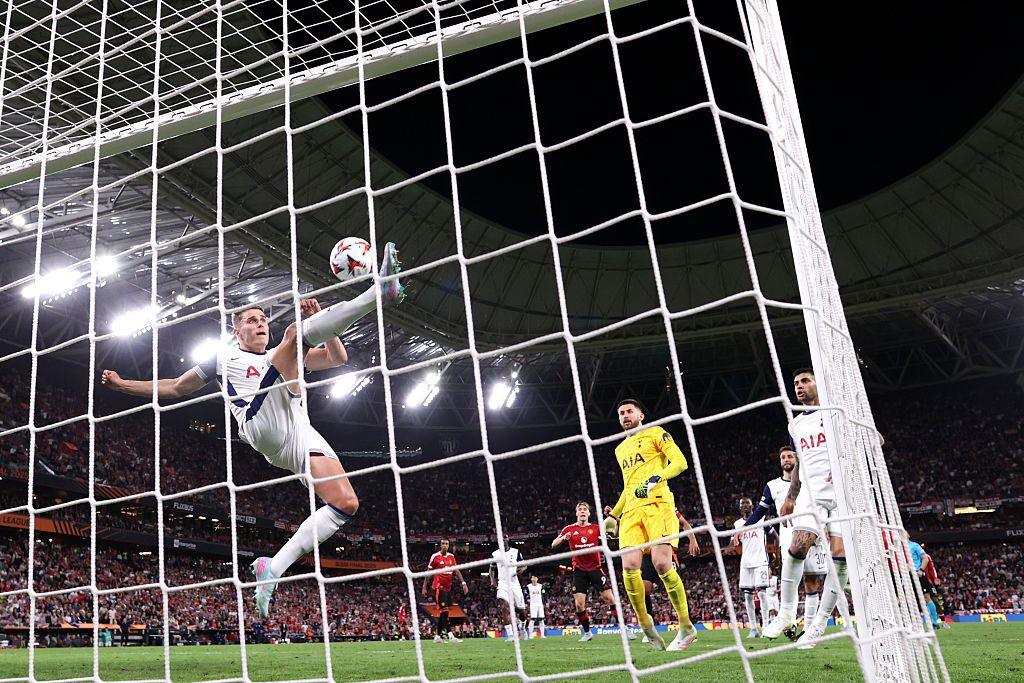 Micky van de Ven clearing a goal off the line