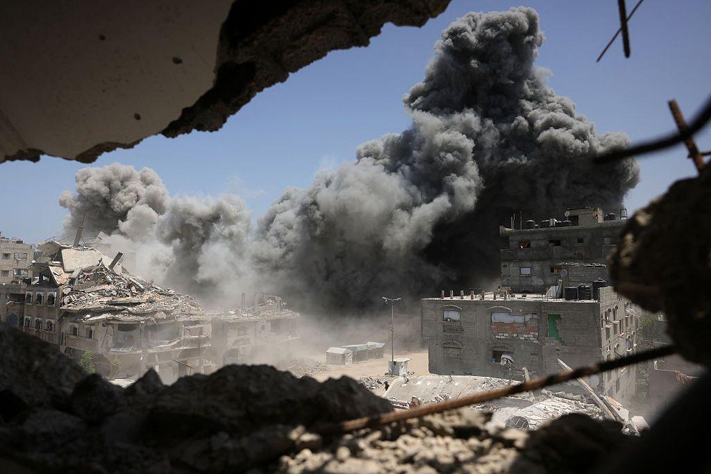 Smoke and debris rise following an Israeli strike on a house west of Jabalia, in the northern Gaza Strip, on June 1, 2025.