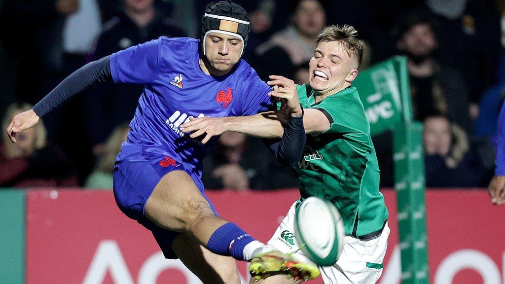 France's Louis Bielle is challenged by Fintan Gunn in Friday night's game in Cork