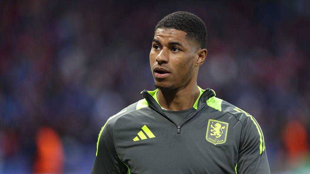 Marcus Rashford in a Villa kit.
