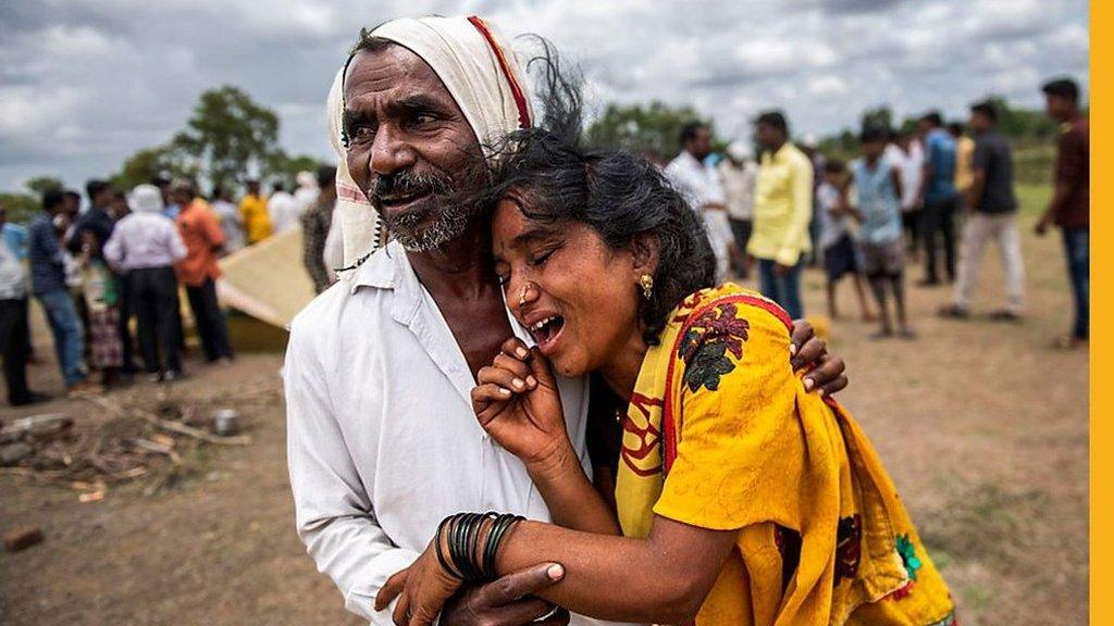 Man hugging a distressed woman