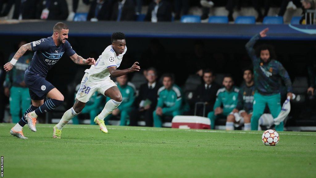 Manchester City's Kyle Walker and Real Madrid's Vinicius Jr chase the ball during the second leg of last season's Champions League semi-final