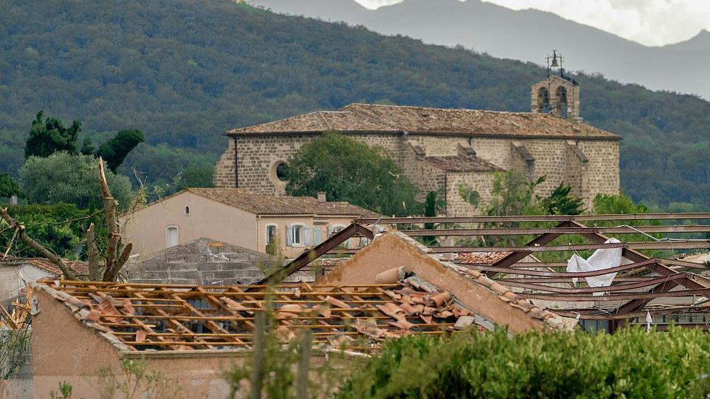 Damaged rooftops on buildings after a tornado struck Pomas, southwestern France on 24 August, 2006.