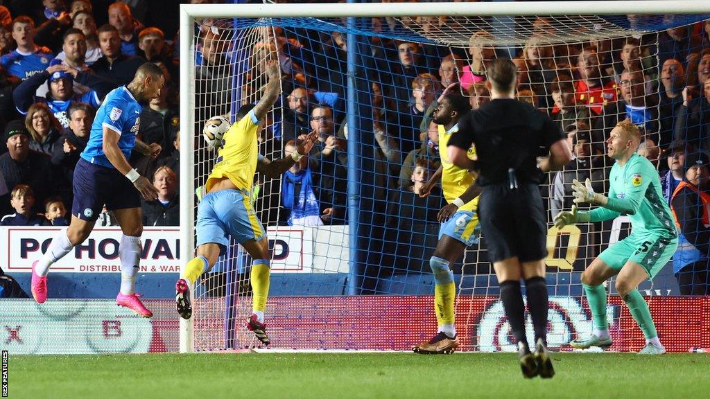 Jonson Clarke-Harris scores Peterborough's fourth