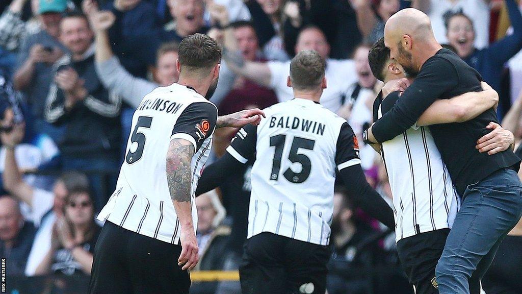 Notts County manager Luke Williams celebrates with his players