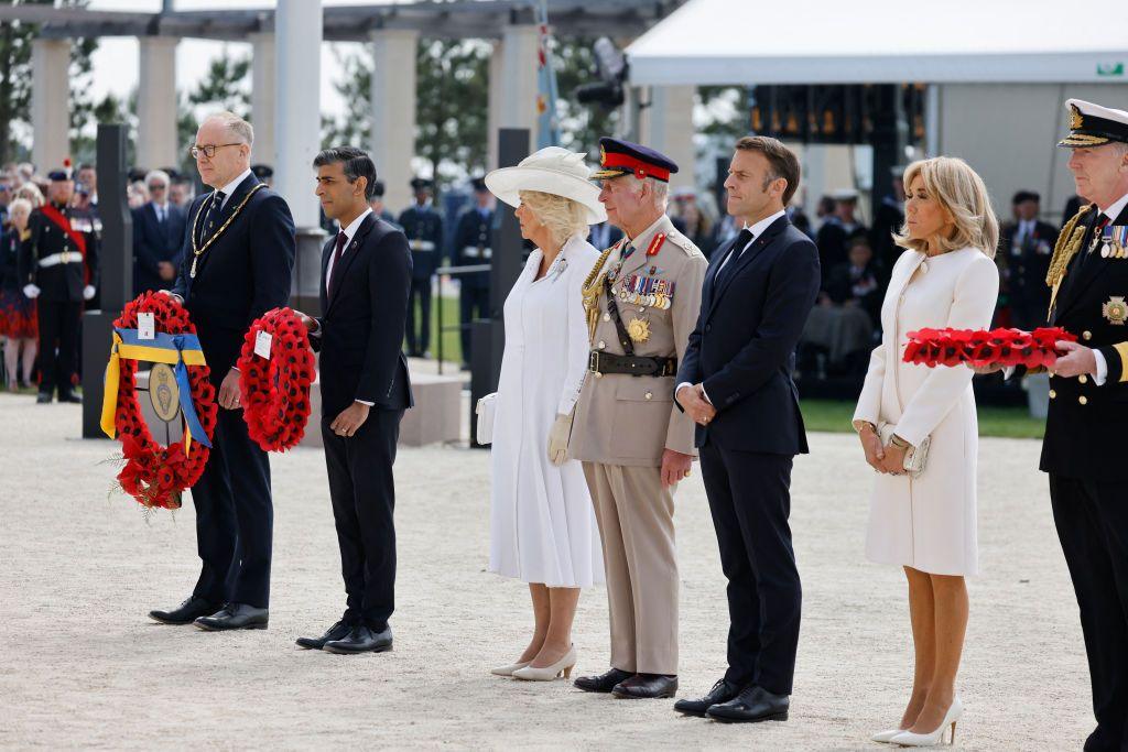 Britain's King Charles III (C), Britain's Queen Camilla (3rdL), France's President Emmanuel Macron (3rdR), French President's wife Brigitte Macron (2ndR) and Britain's Prime Minister Rishi Sunak (2ndL) attend the UK Ministry of Defence and the Royal British Legion's commemorative ceremony, 6 June 2024