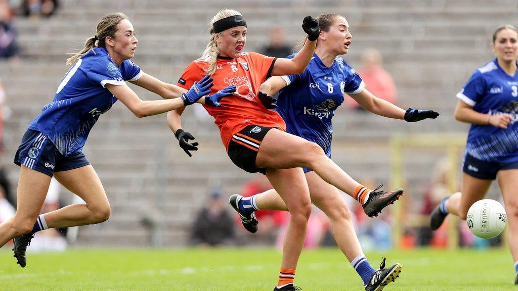 Niamh Coleman fires home Armagh's fifth goal despite pressure coming from Sophie Slowery and Neasa Byrd