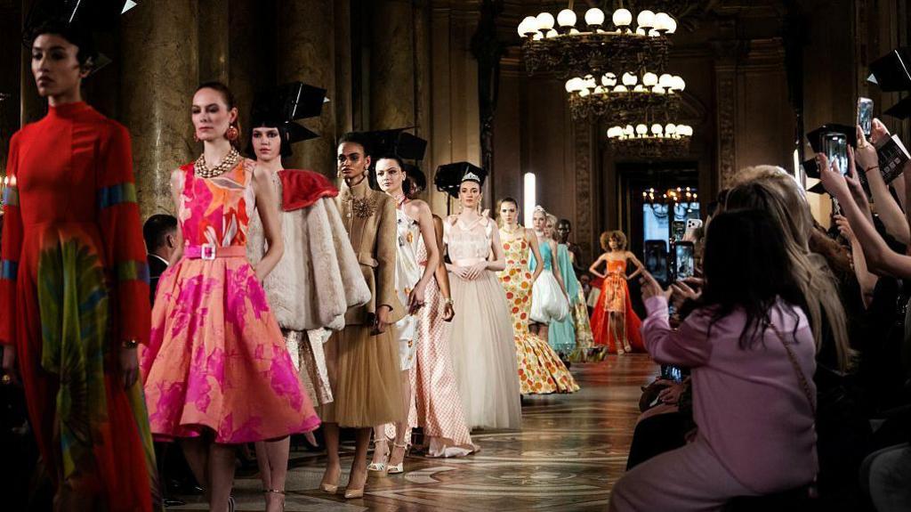 models walking down a runway