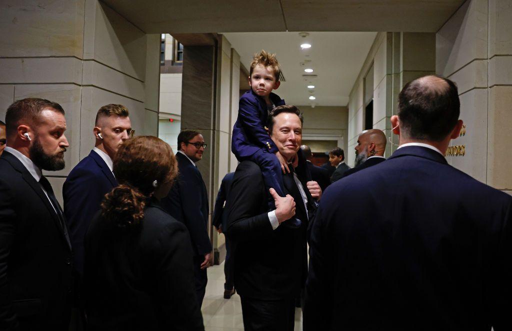 Tesla CEO Elon Musk, Co-Chair of the newly announced Department of Government Efficiency (DOGE) carries his son "X" on his shoulders at the US Capitol 