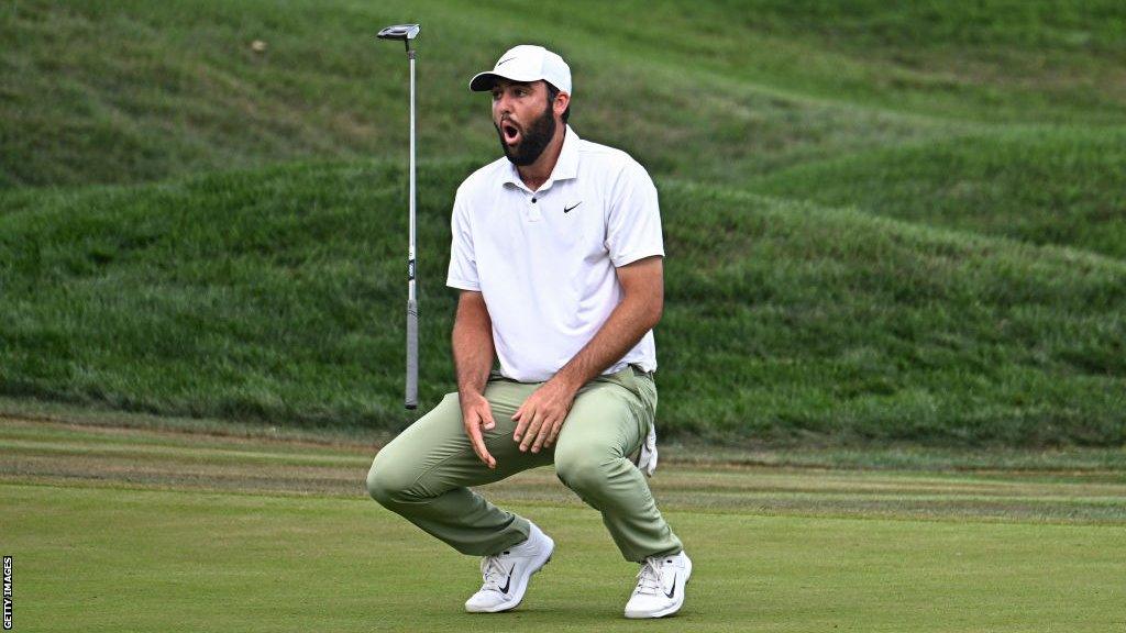 Scottie Scheffler reacts to missing a putt on the 18th hole at Sawgrass in the final round of the Players Championship