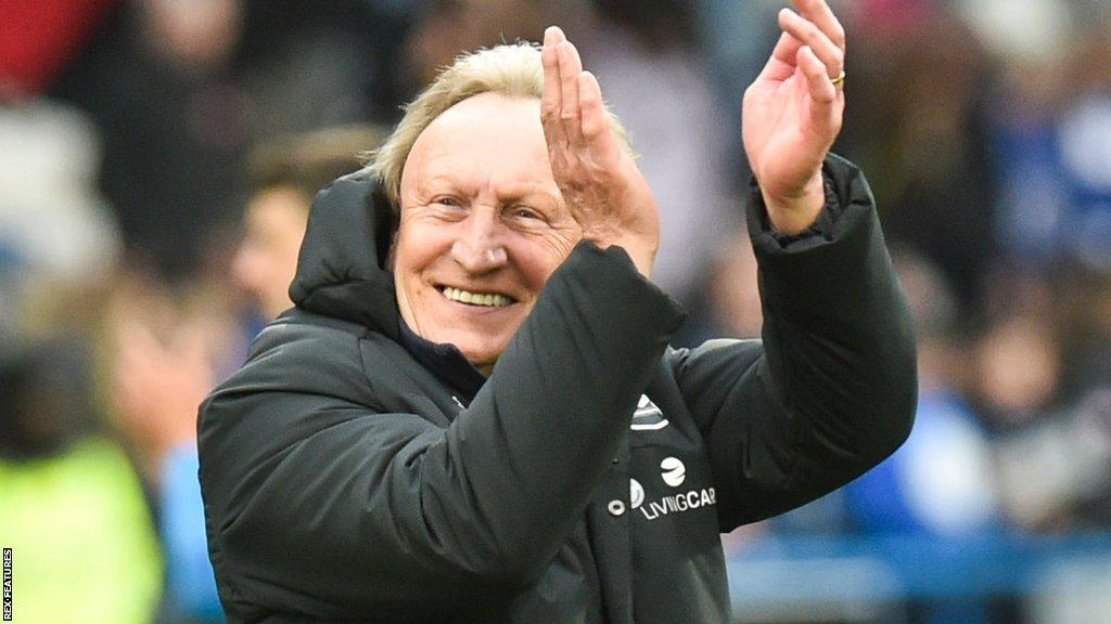 Huddersfield boss Neil Warnock applauds the fans