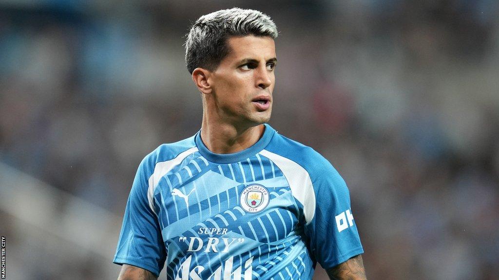 Joao Cancelo playing for Manchester City