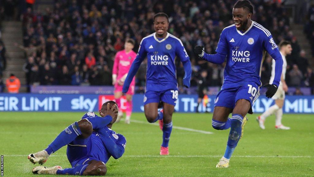 Patson Daka of Leicester City slides on the ground and covers his face as he celebrates scoring against Plymouth