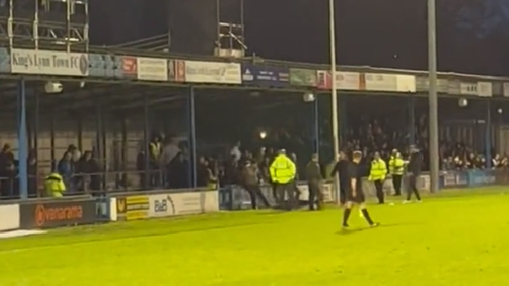 Fans appearing to fight at the King's Lynn Town FC vs Boston United match