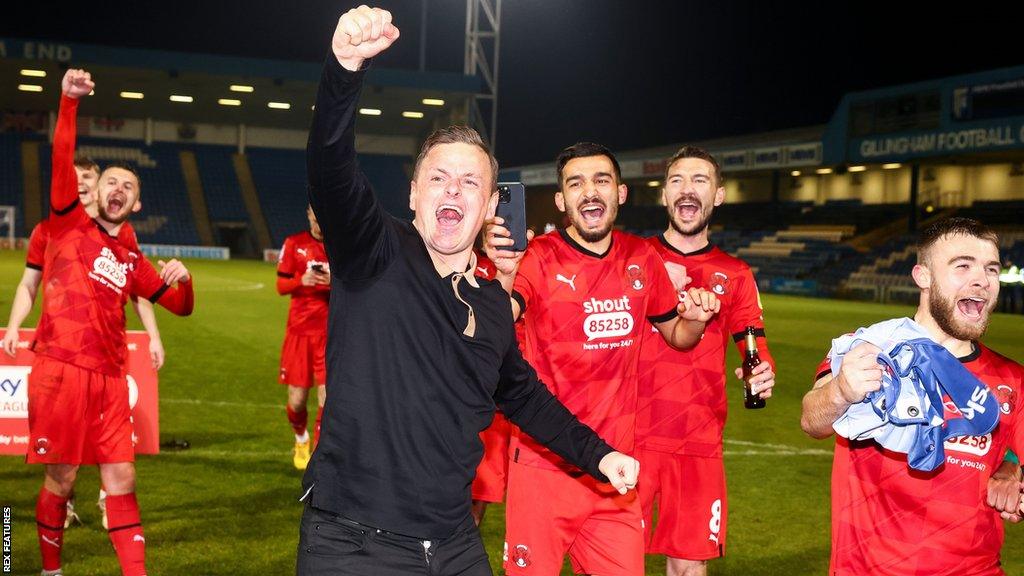 Leyton Orient head coach Richie Wellens celebrates promotion with his players