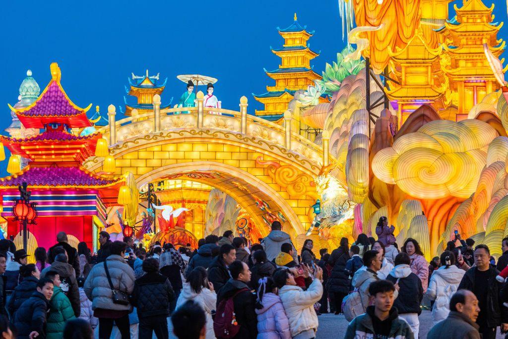 People enjoying the light installations at the Zhonghua Lantern World in Zigong City, Southwest China's Sichuan province. 