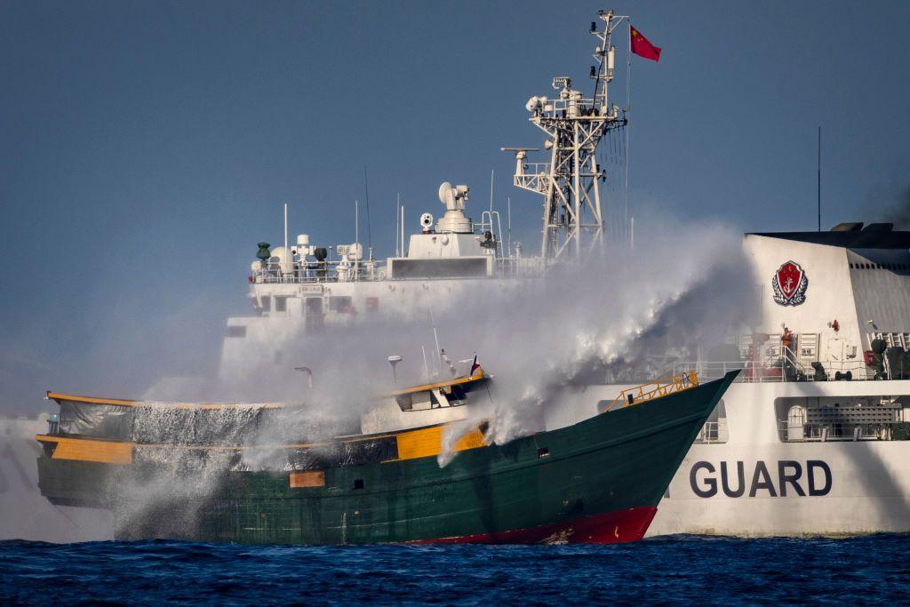 A Chinese Coast Guard ship fires a water cannon at Unaizah May 4, a Philippine Navy chartered vessel, conducting a routine resupply mission to troops stationed at Second Thomas Shoal, on March 05, 2024 in the South China Sea