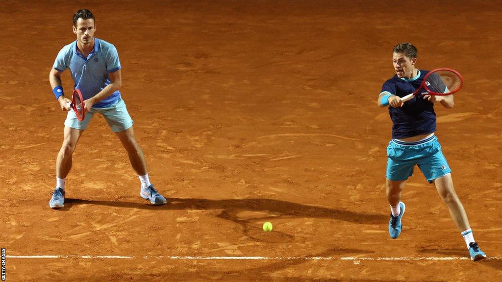 Neal Skupski and Wesley Koolhof in action