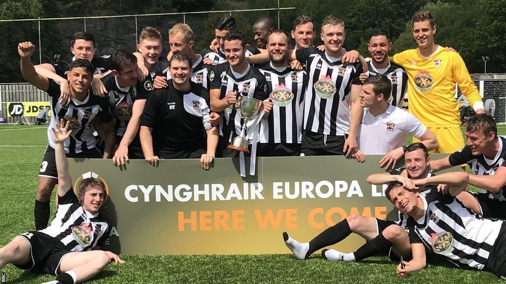 Cefn Druids players celebrate their play-off final win over Cardiff Met in 2018