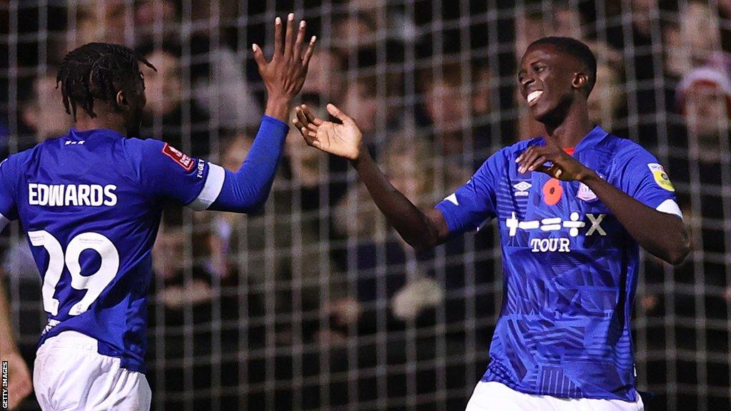 Panutche Camara (right) celebrates a goal for Ipswich Town