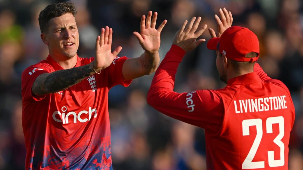 England players Brydon Carse (left) and Liam Livingstone (right) celebrate a wicket