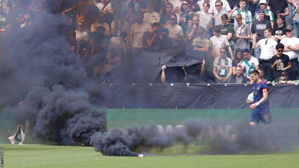 Smoke bombs on the pitch