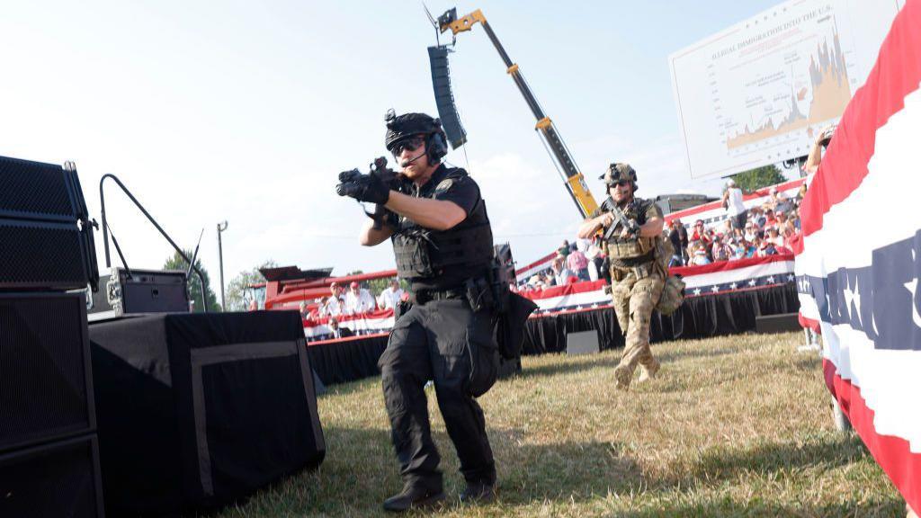 Armed police react after Crooks shoots at Trump