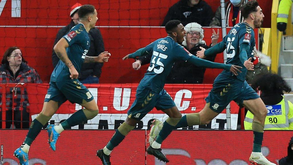 Matt Crooks wheels away in celebration after scoring for Middlesbrough at Manchester United