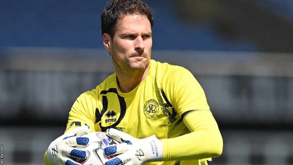 Asmir Begovic prepares to throw the ball during a QPR match