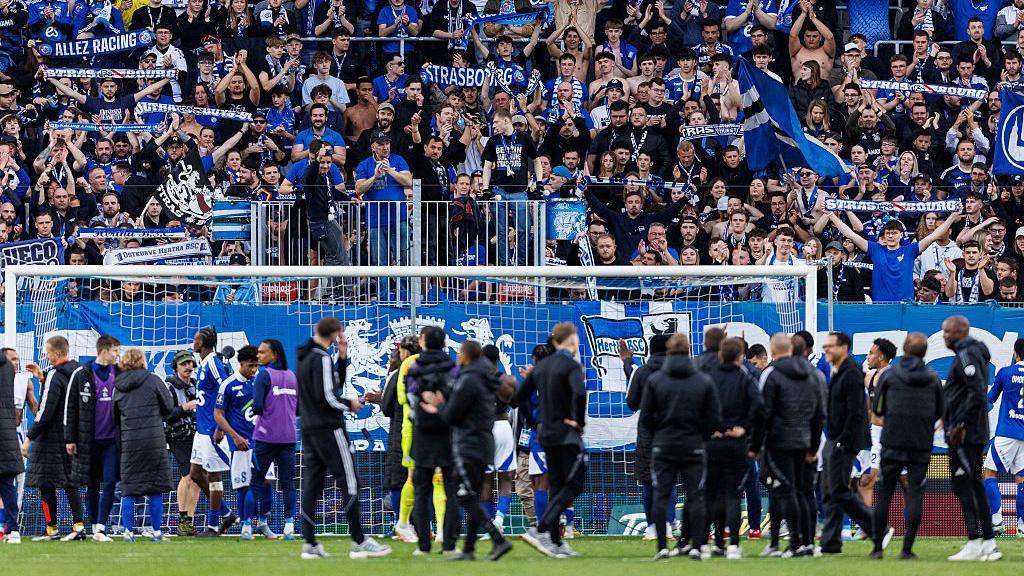 Strasbourg supporters celebrate with their team