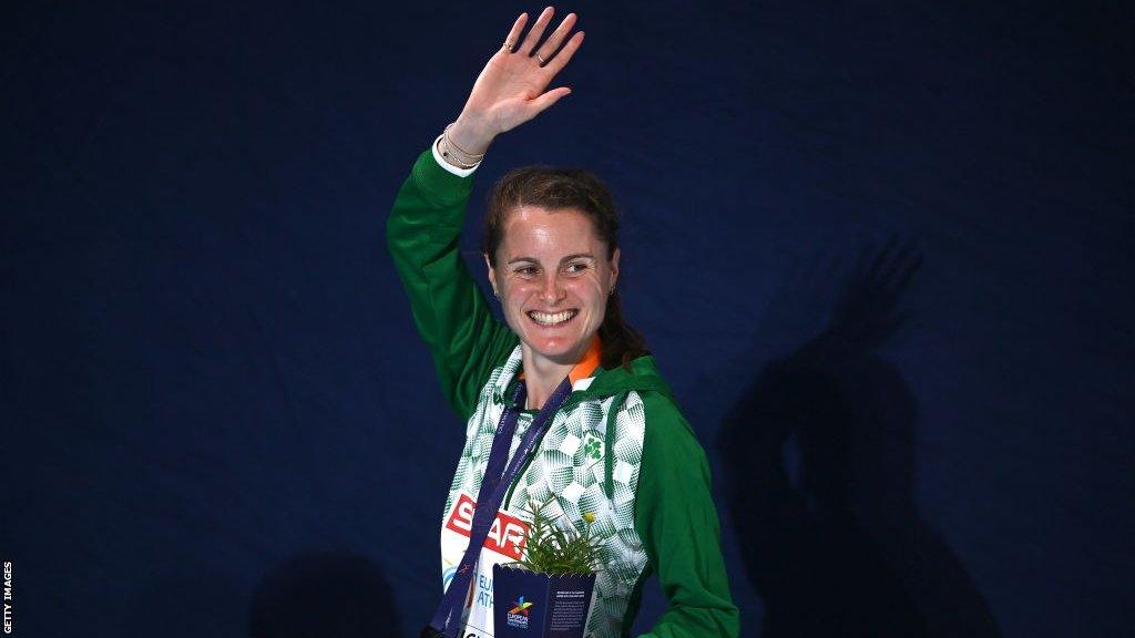 Ciara Mageean waves on a podium