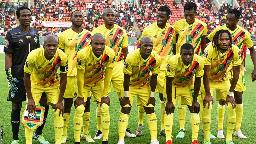 Zimbabwe players line up ahead of a match at the 2021 Africa Cup of Nations