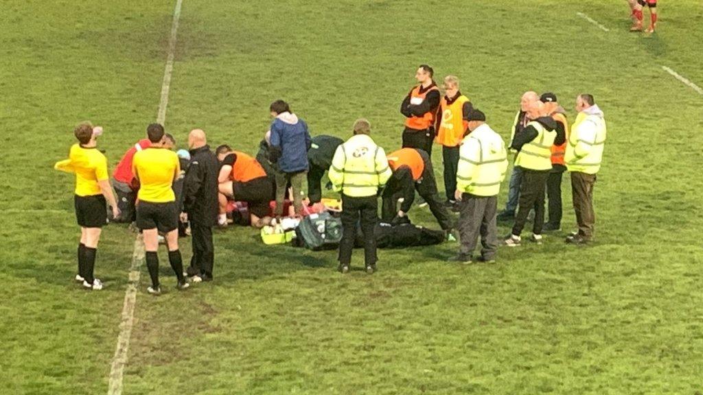 Tom Everard is tended to after being injured